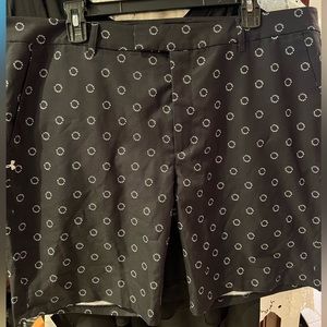 NWT Under Armour women's black golf shorts. Size XL.